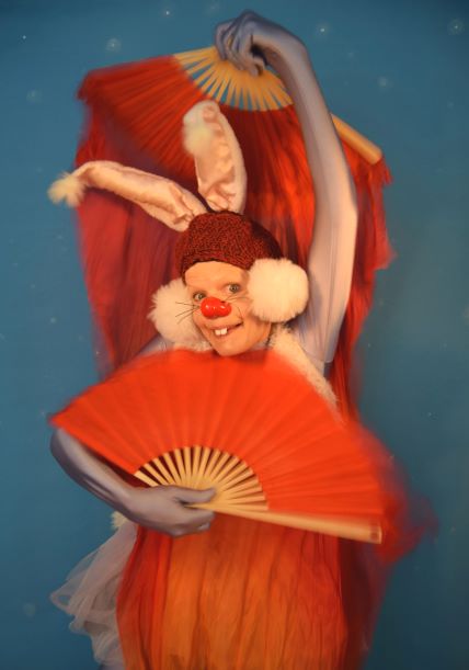 Rabbit holding two fans